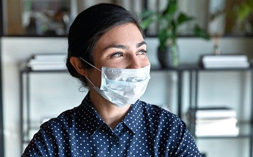 Young indian female company manager protective mask