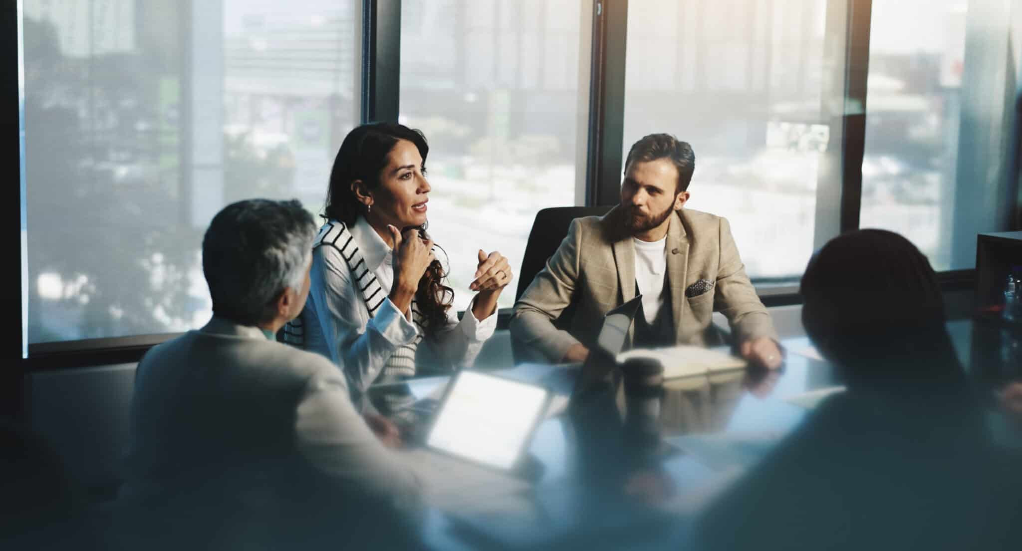 Leadership team reviewing growth strategy during a corporate planning session.