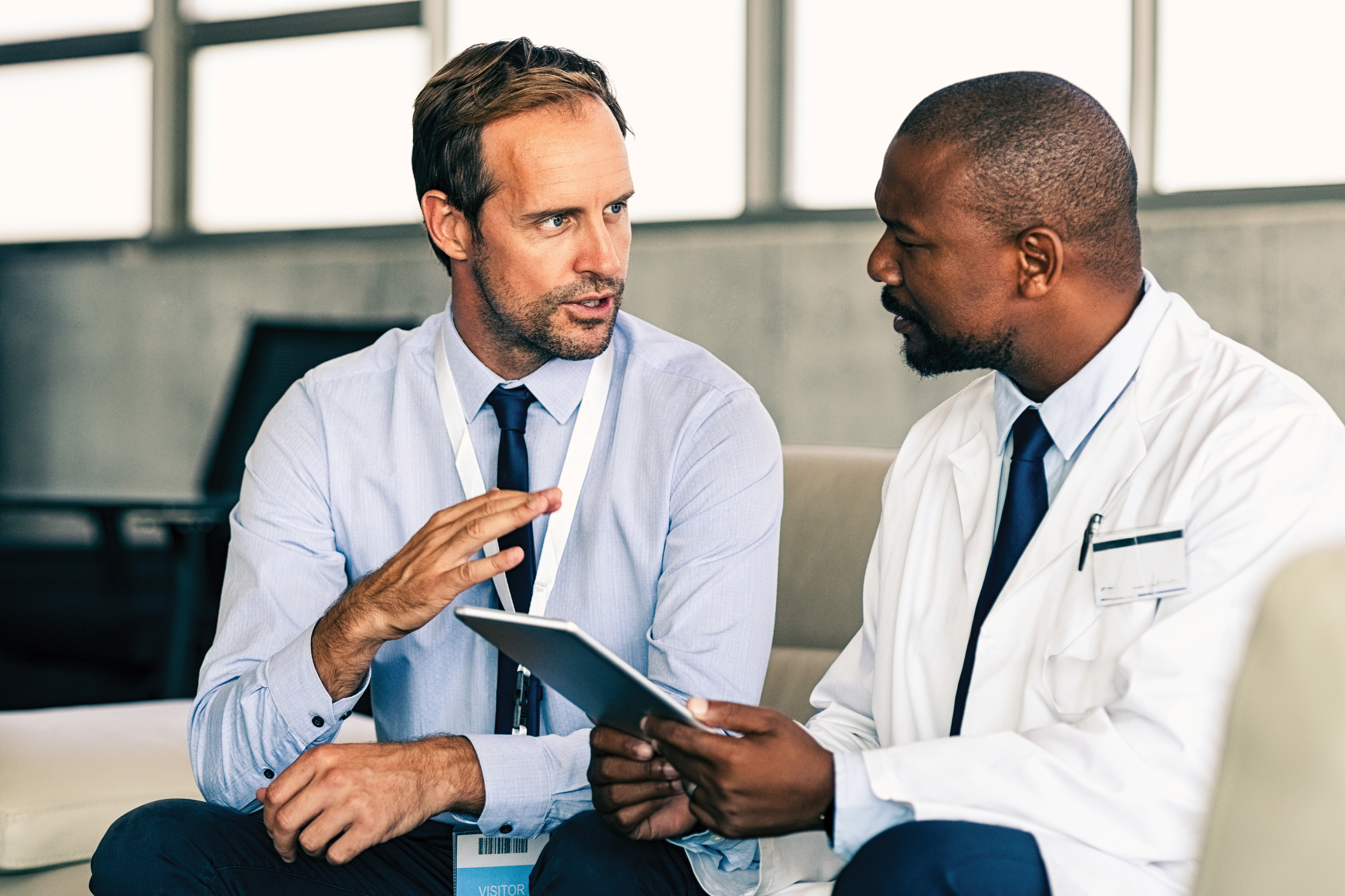 Doctor in conversation with advisor