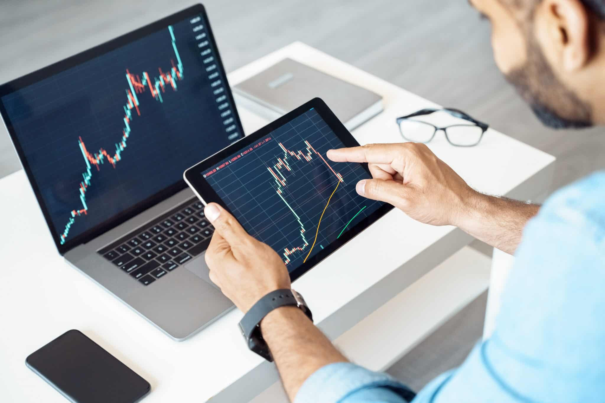 Healthcare technology team member analyzing data visualization dashboards for operational insights.