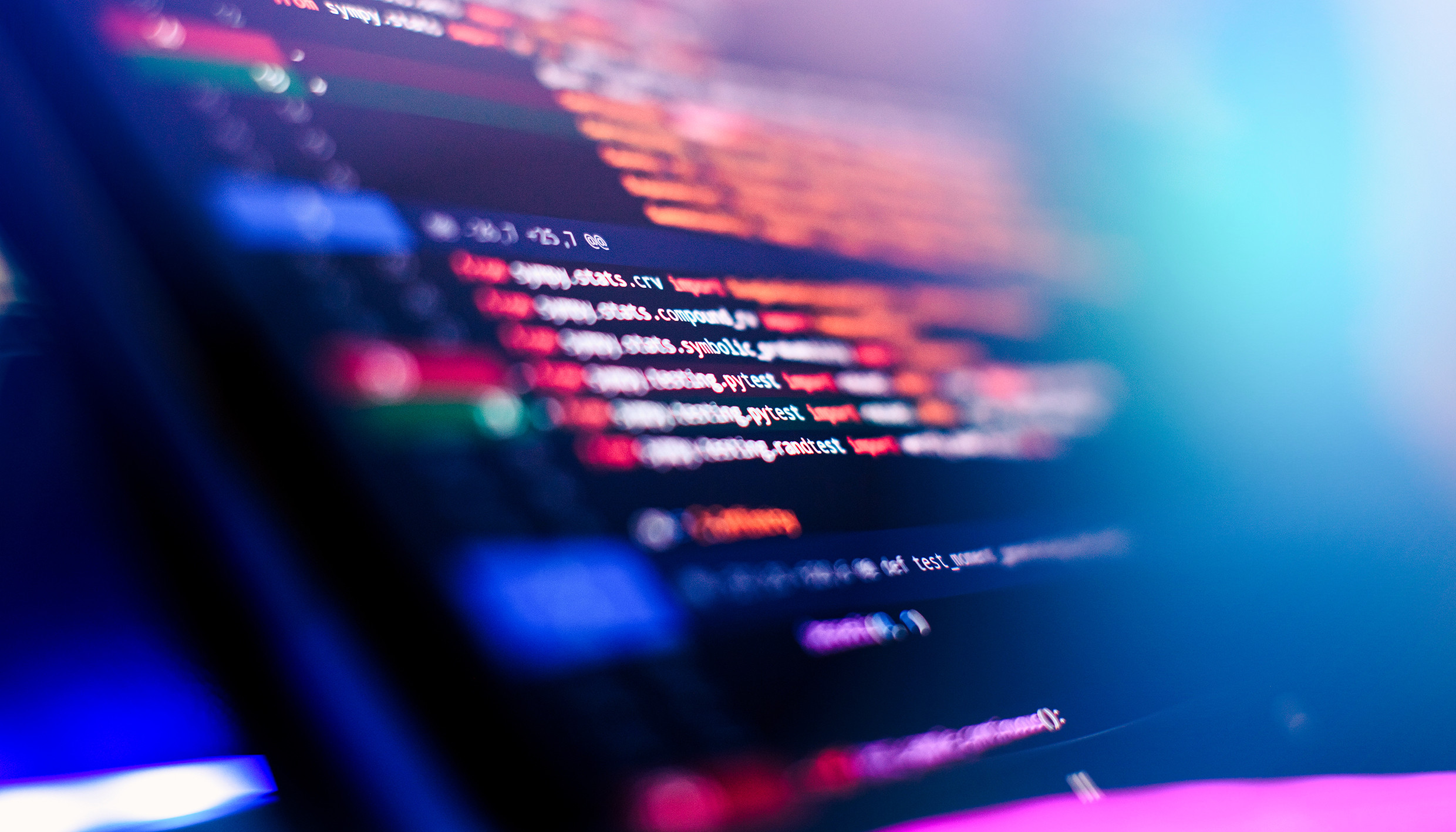 Close-up of computer code on a screen, representing software development, data processing, and digital technology.