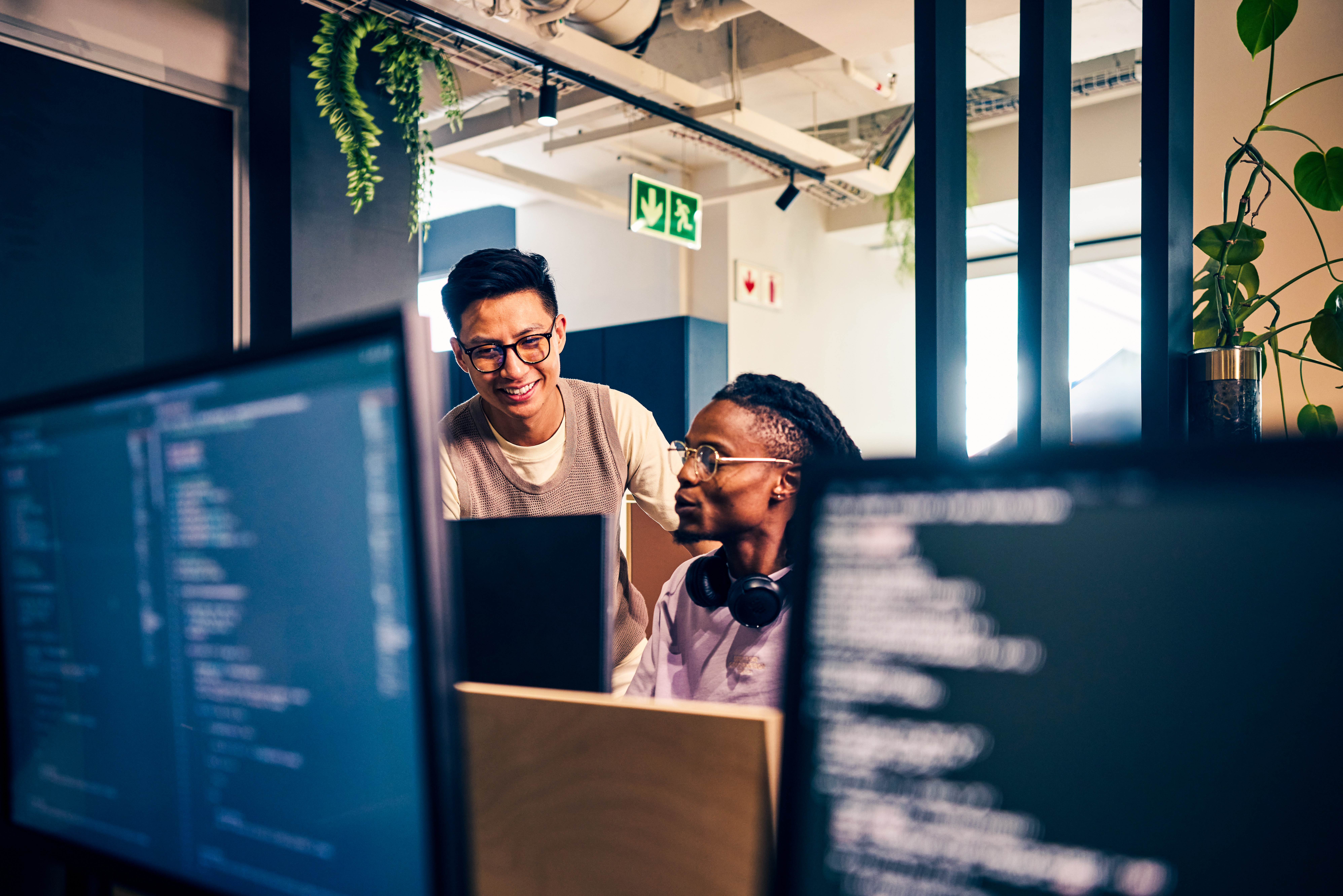 Software engineers building innovative healthcare technology solutions in a collaborative workspace.