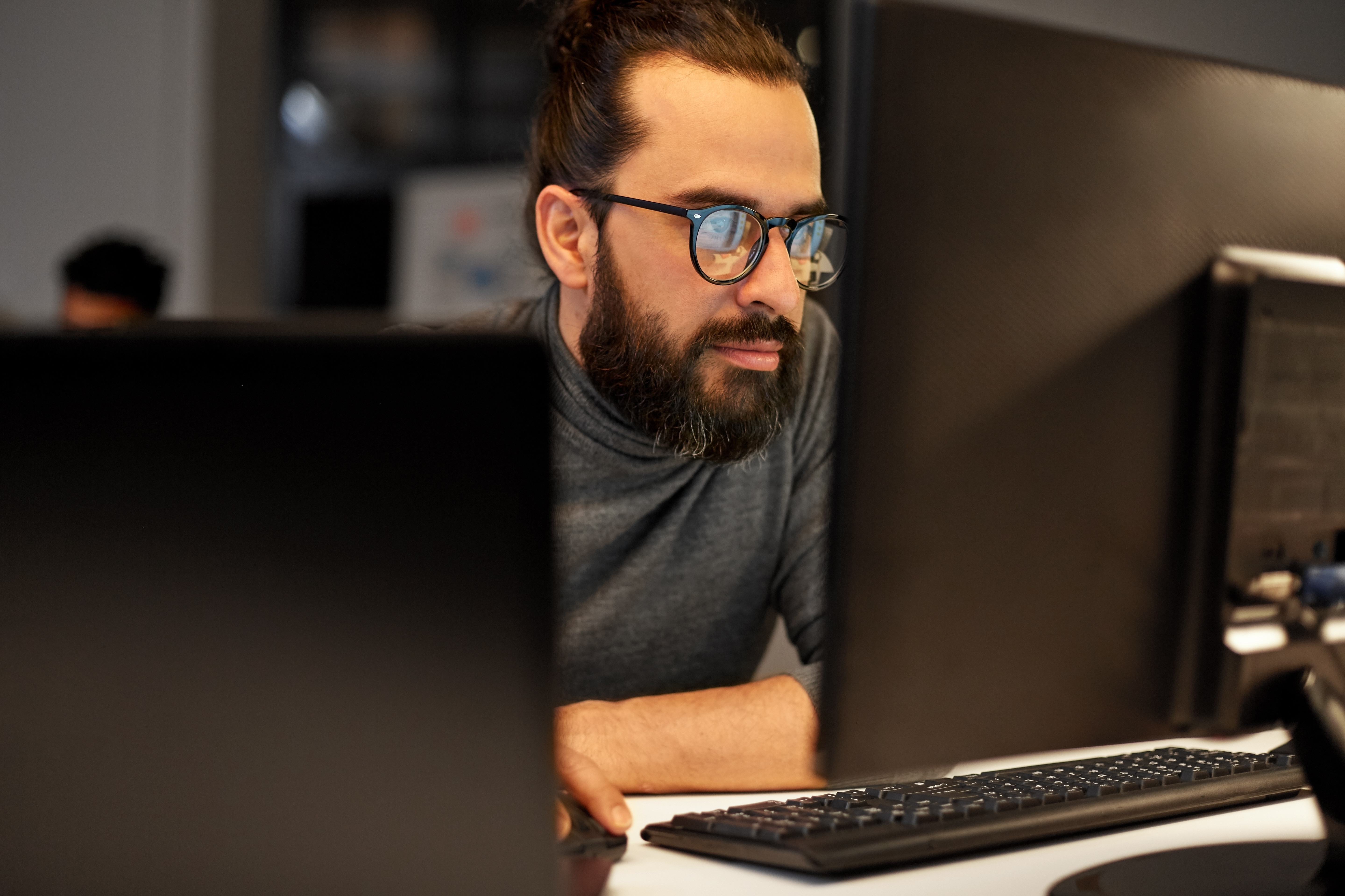 close up of creative man working at night office