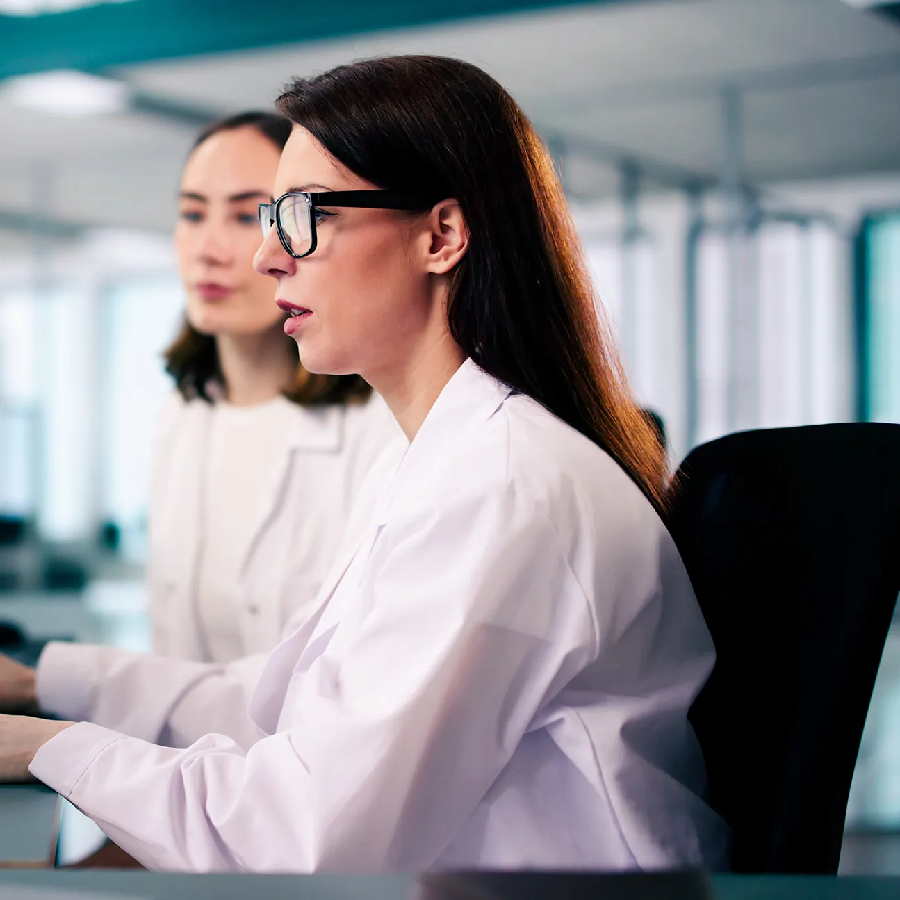 young female medical coder maintaining billing spreadsheets