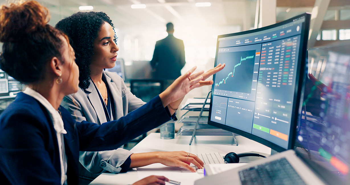 Employees, computer and night for finance, stock market and graphs on screen for data analytics. Business people, collaboration and teamwork or support, training and statistics on investment revenue