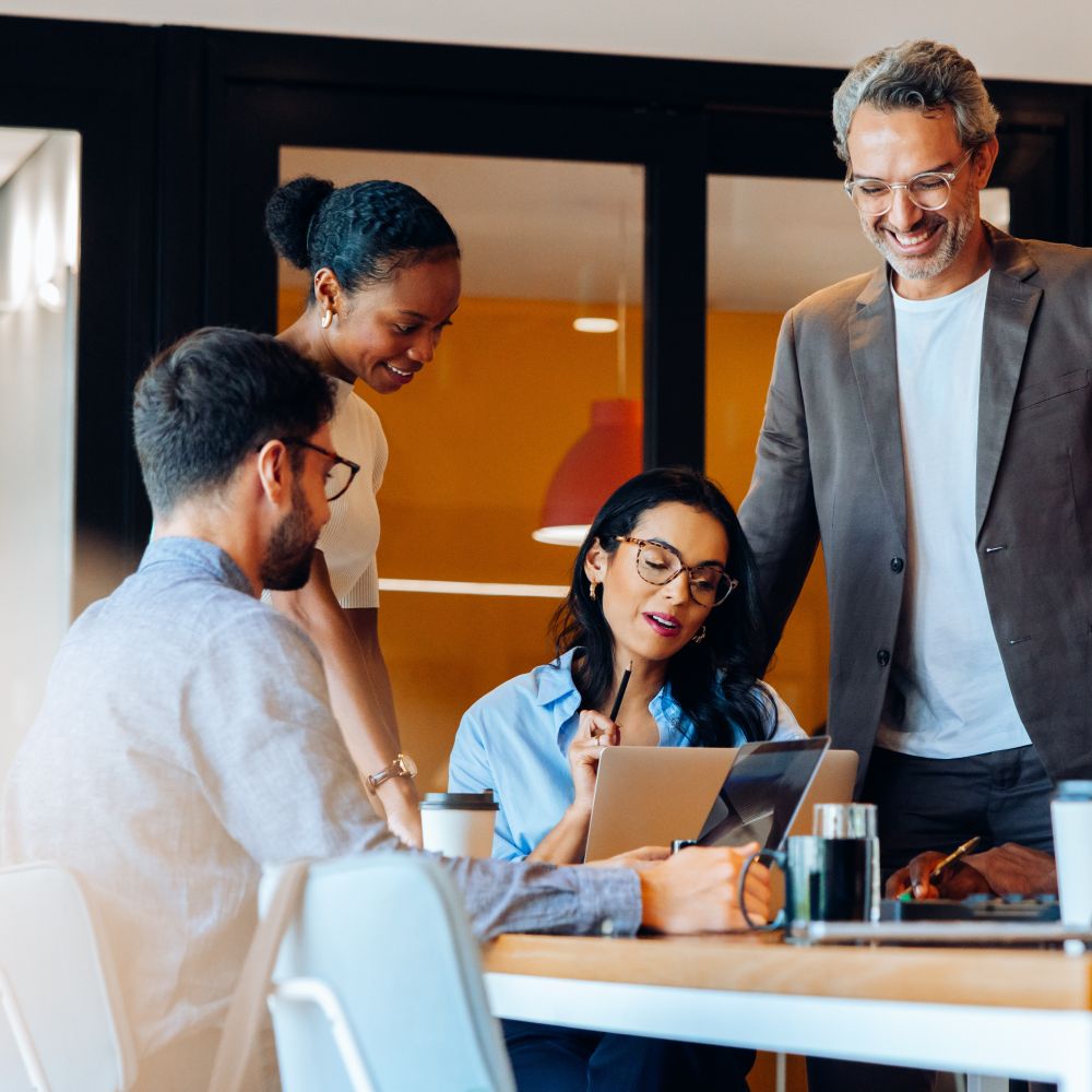 A diverse group of professionals discussing ideas around a table