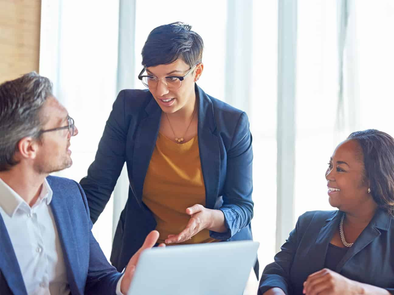 Healthcare business professionals collaborating on revenue cycle management strategy, operational performance, and organizational goals