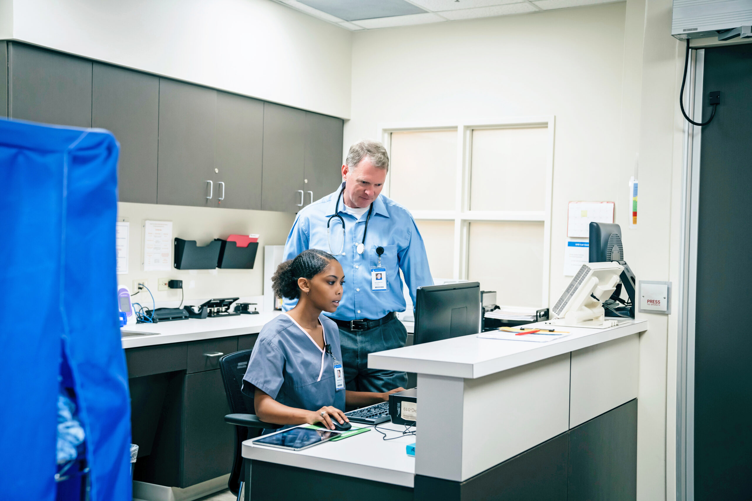 Doctor and nurse using computer in hospital