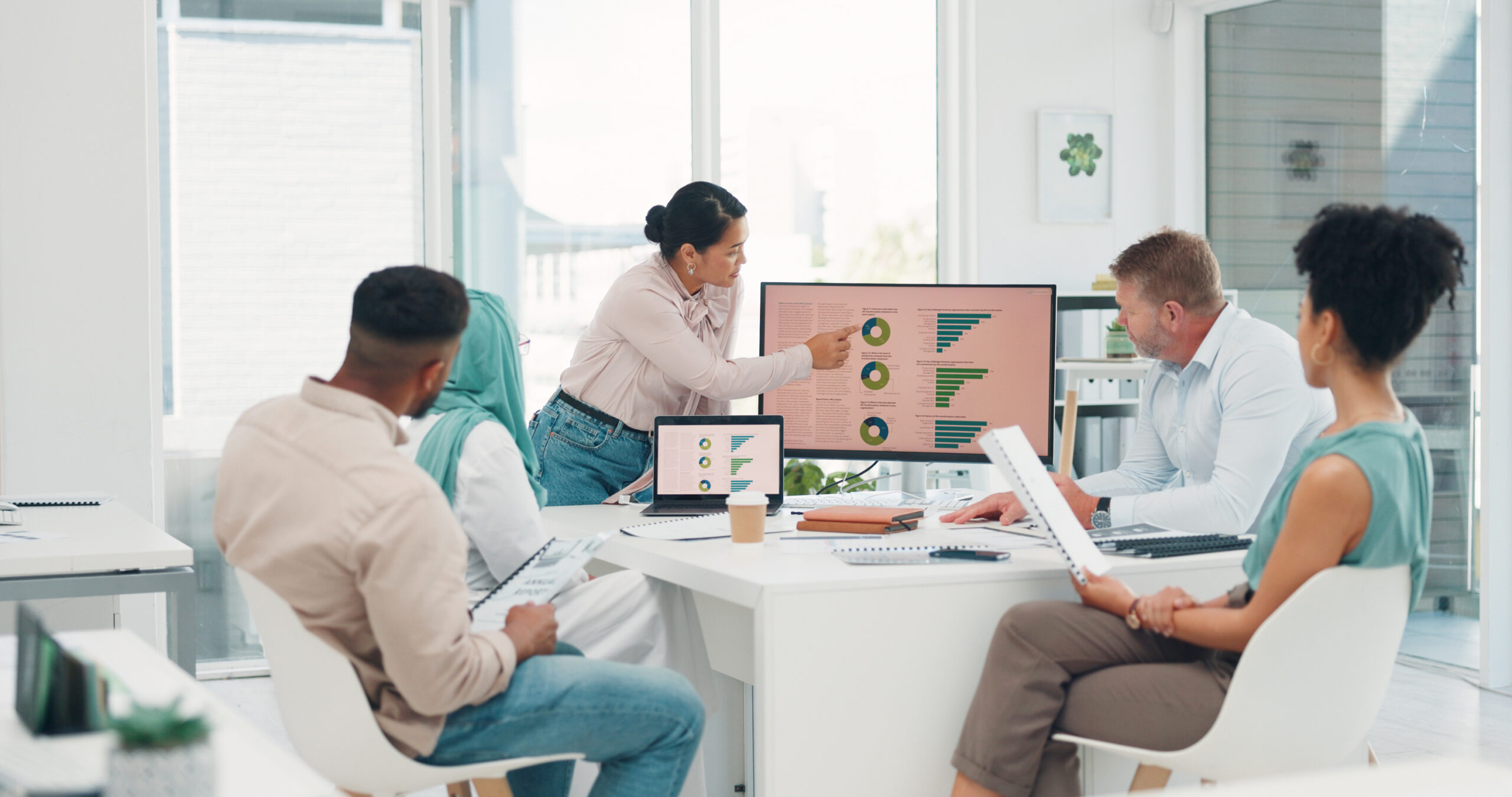 Business people, presentation and computer with woman, planning or graph for target, goal or kpi. Corporate executive team, leader and infographic vision on pc, marketing and motivation in New York