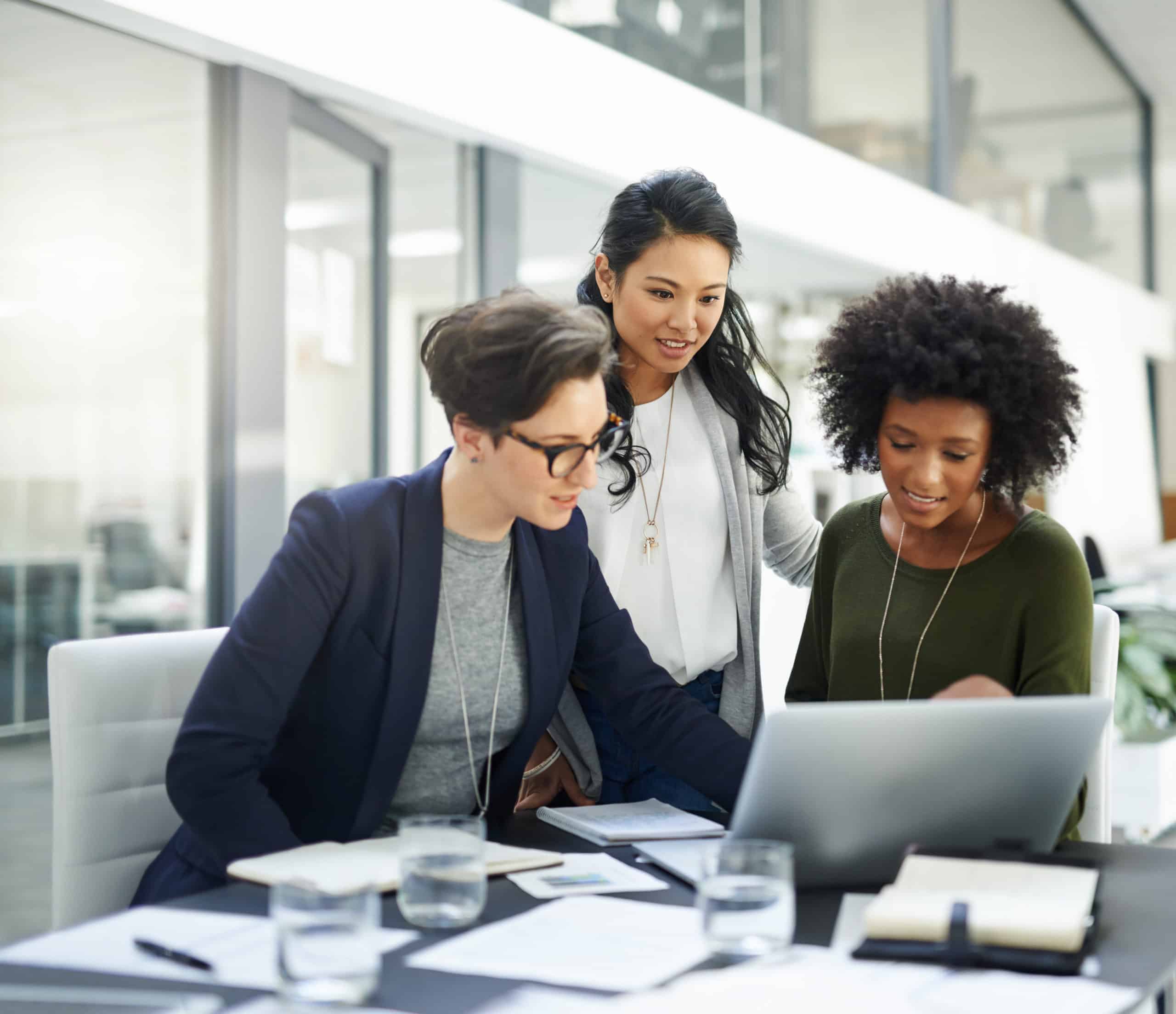 Shot of a group of businesswomen using a laptop during a meeting at work|59% rank eligibility #1 RPA use case