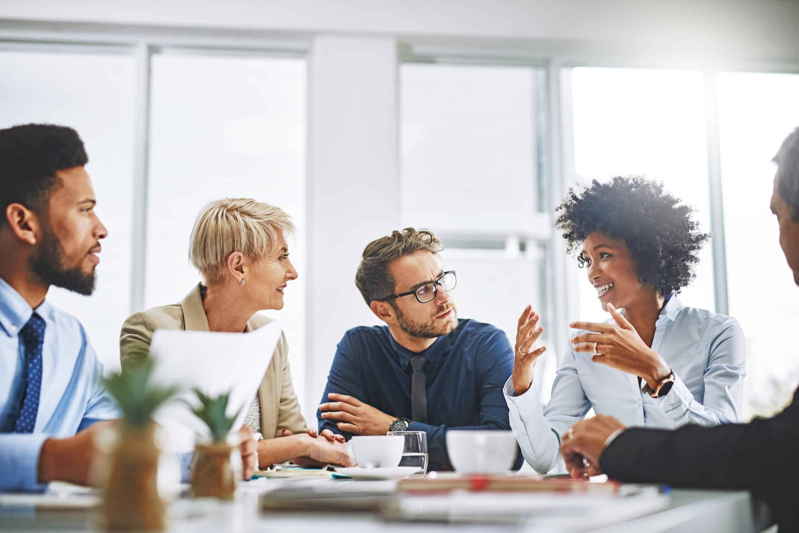 Shot of a group of businesspeople sitting together in a meeting